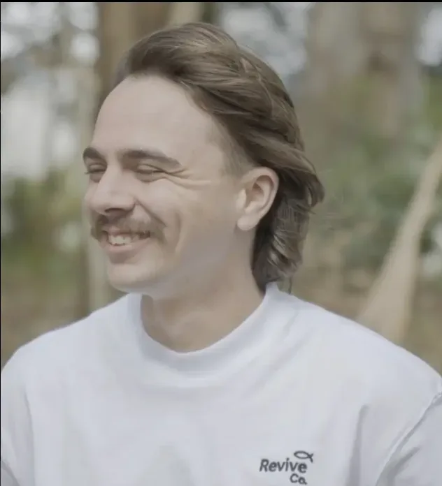 The Serve Shirt, front view, worn outdoors