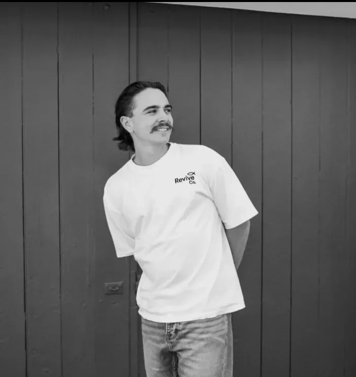 The Soar Tee, front view, worn outdoors