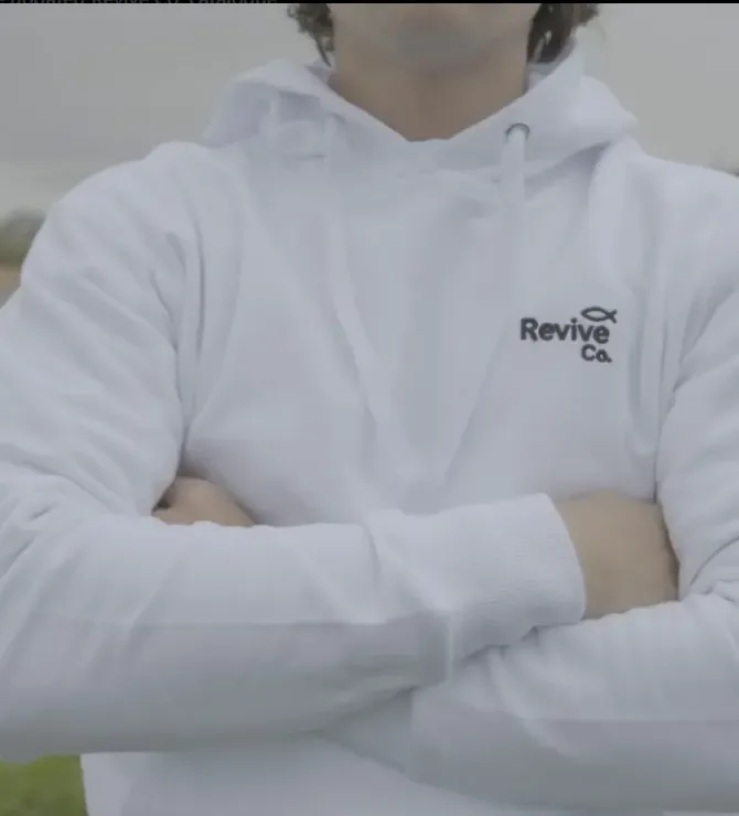 The Steadfast Hoodie, front view, worn outdoors